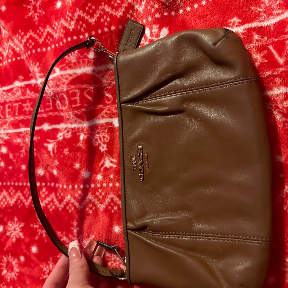 Brave new coach wristlet wallet in the color brown